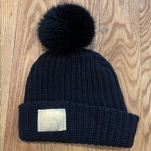 Love Your Melon Black Pom Pom Beanie with Gold Patch